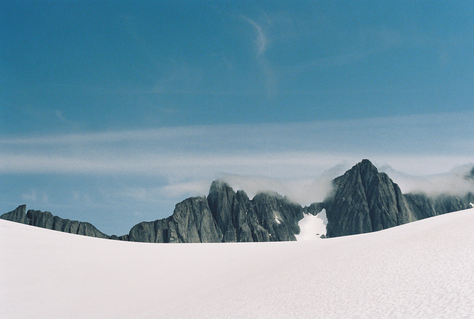 Fog rolling in over the Storm Range above the Vaughan Lewis Glacier in Juneau, Alaska
